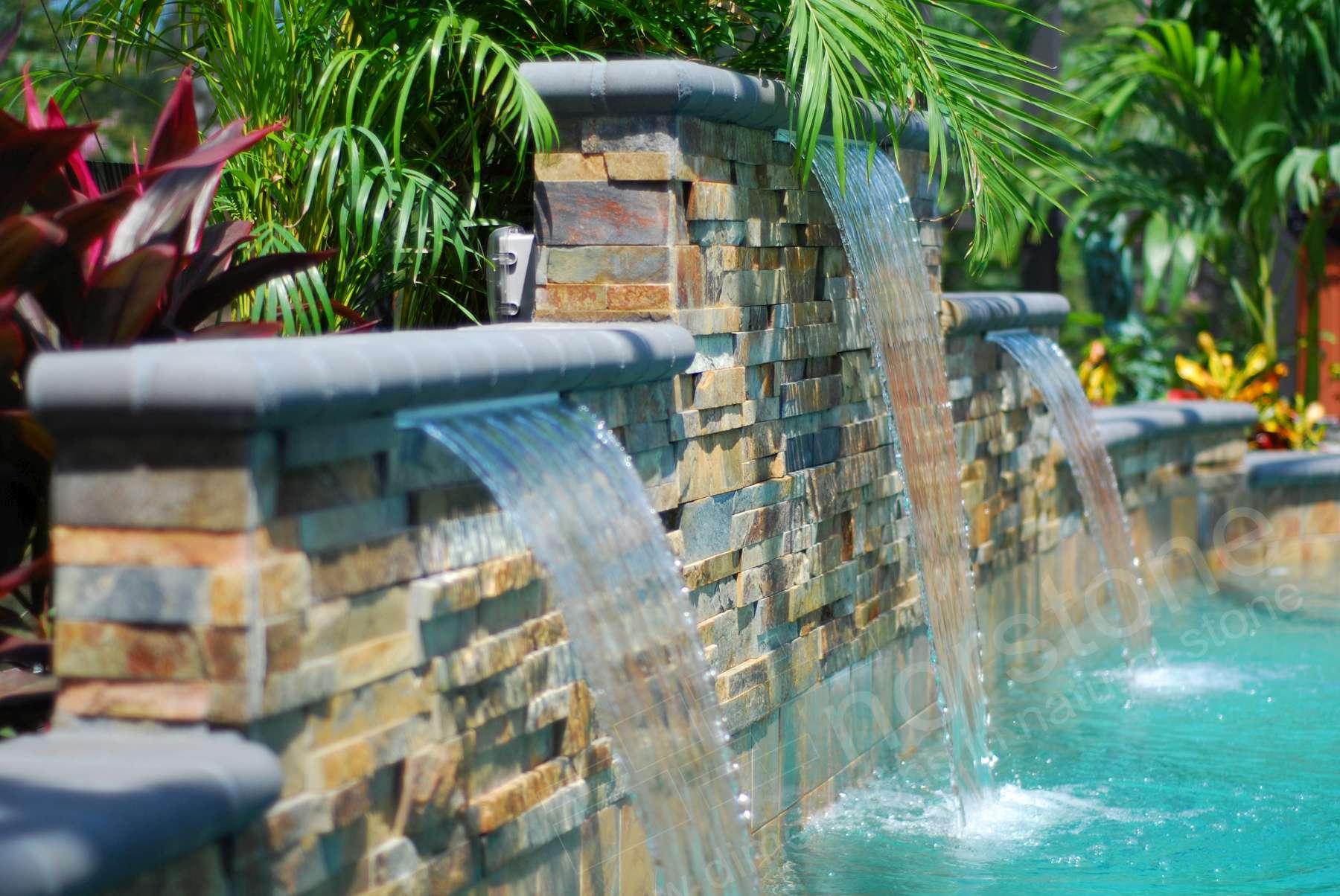 Stacked Stone Pool Water Feature with multiple levels and three waterfalls